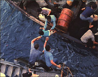 20120515-South_China_Sea..a mphibious_cargo_ship ietnamese_refugees_aboard_a_small...jpg